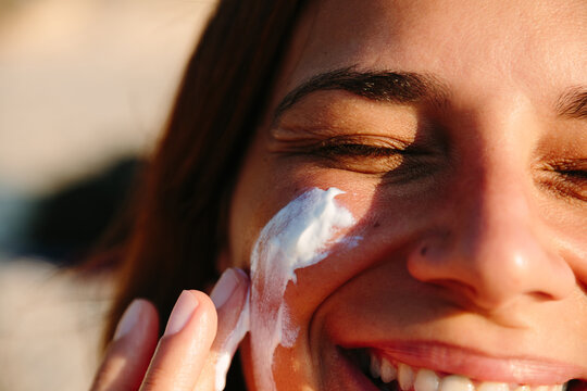 Woman Applying Sunscreen