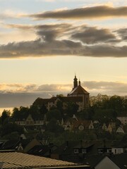 View of Fulda with Frauenberg Monastery during the golden hour at sunset