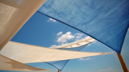 Modern Terrace in Summer with Stylish Shade Sails Under a Bright Blue Sky