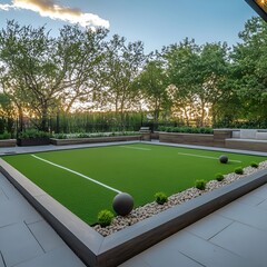 Bocce ball court with artificial turf is the center piece of an outdoor terrace.
