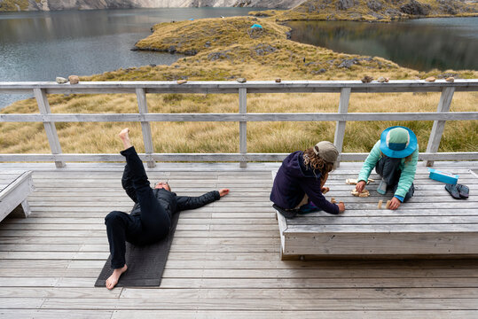 Family relaxing at Angelus Hut, New Zealand