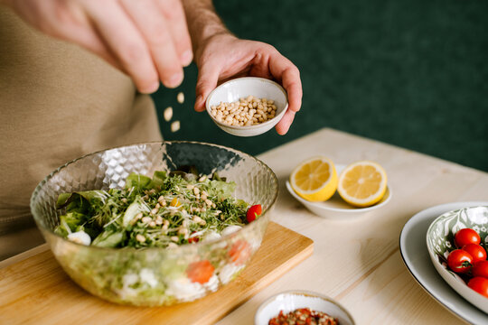 Adding Pine Nuts To Salad