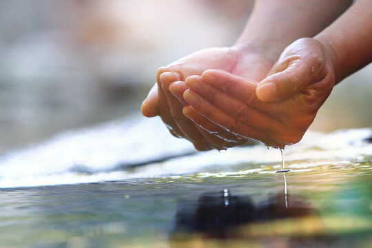 Precious water in your hand, clear, transparent and clean source of life, World Water Day background
