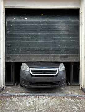 car stuck under roller shutter