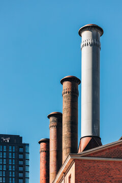 Industrial Chimneys Against Blue Sky