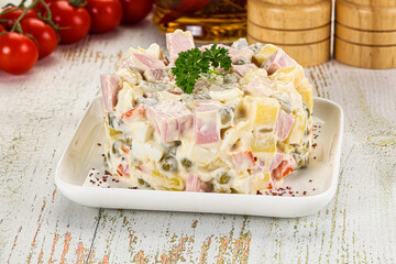 Russian traditional Olivier salad with sausages