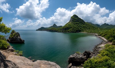 Scenic coastal view of a bay with mountains and lush vegetation, perfect for travel or nature photography