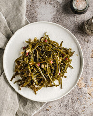 pickled seaweed on a white plate