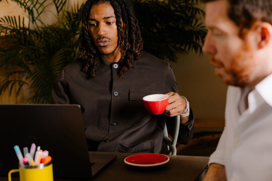 A small creative team working on a project in a coworking space