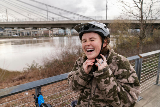 putting on bike helmet