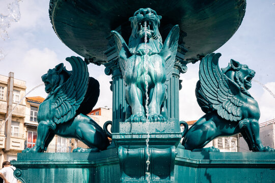 Ornate bronze fountain with mythical winged lions