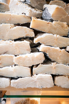 Stacked pieces of dried salted codfish at a market