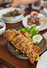 Authentic Indonesian Goreng kipas , deep fried fish with spicy chilli paste.