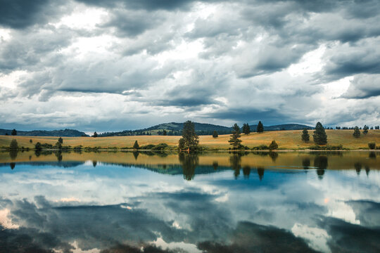 Stormy Reflections Over Montanas Rolling Hills