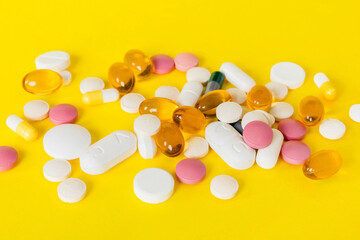 Many different colorful medication and pills perspective view. Set of many pills on colored...