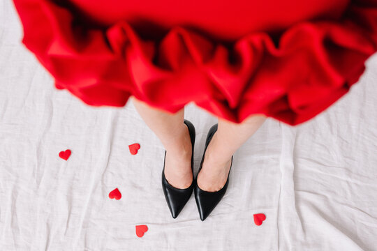 Red dress with ruffles and black heels on love hearts