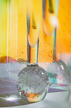 Bubbles rise in sparkling drink captured with vibrant colors