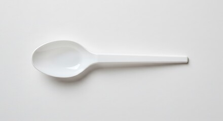 White Plastic Spoon on White Background