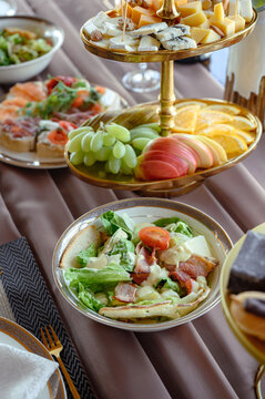 pasta with chicken and vegetables. Brusketta with different fillings on the plate.
