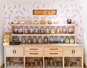 Eco-friendly pantry with glass jars on wooden shelves