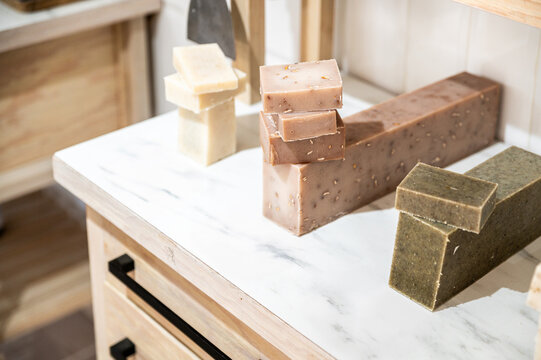 Natural handmade soap bars on a marble counter