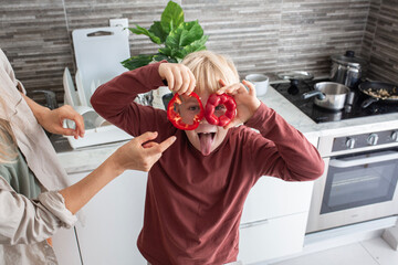 mother and son preparing salad
