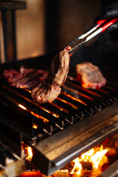 Grilling Steak Over Open Flames