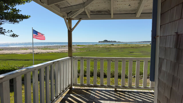 Coastal landscape Ocean with American Flag 