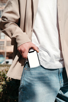 Man taking out a blank mobile phone from his pocket