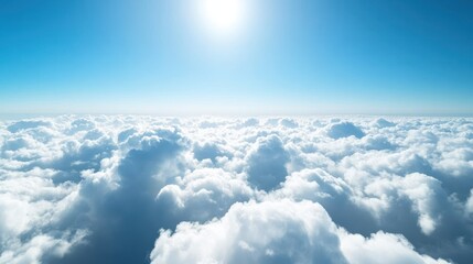 Vast expanse of fluffy clouds beneath a brilliant sky.