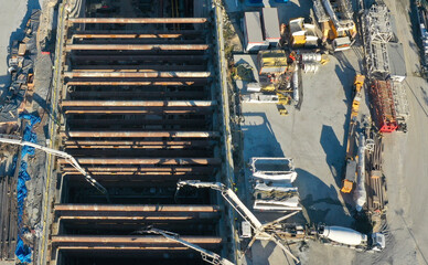 Aerial view of concrete delivery at metro station construction