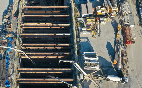 Aerial view of concrete delivery at metro station construction