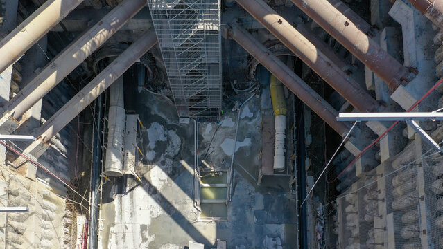 Aerial View of Urban Construction Site with Scaffolding and Steel Beam