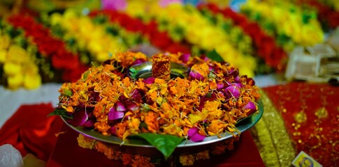 Vibrant Floral Arrangement on Decorative Plate with Colorful Background