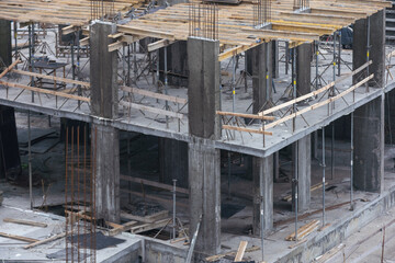 Construction crane on Housing. Construction site with buildings under construction. Tower cranes in action. Crane during formworks. Multi Storey Residential Buildings construction, aerial view.