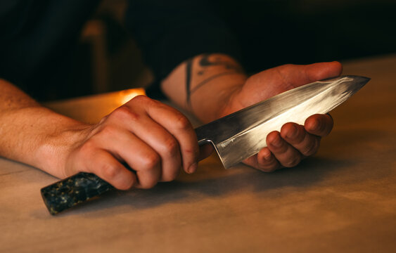 Sushi chef preparing with precision and skill