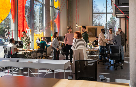 Modern coworking space with diverse people in creative environme