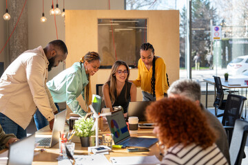 Team collaborating in modern office workspace