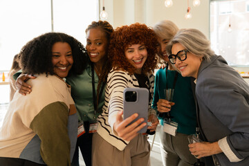 Group of diverse colleagues taking a friendly selfie