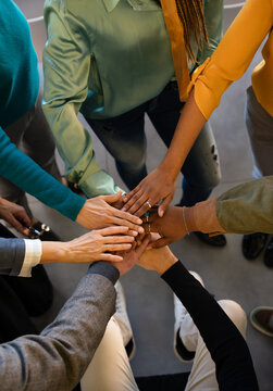Teamwork and unity symbolized by joined hands