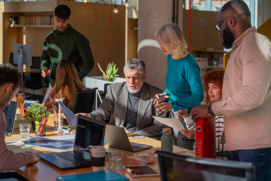 Diverse team collaborating in a modern office setting