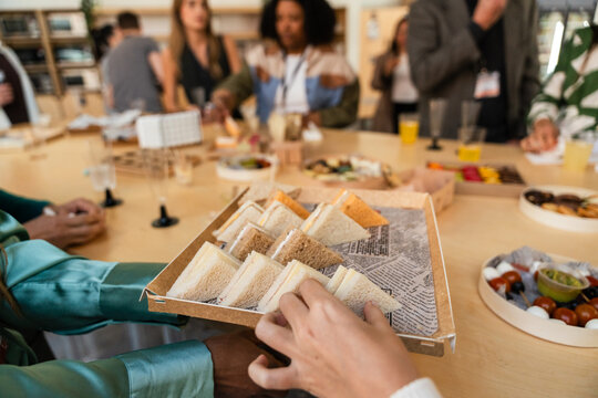 Office gathering with diverse snacks on display