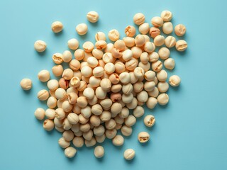 an image of a pile of nuts on a blue surface, there is a pile of nuts on a blue surface