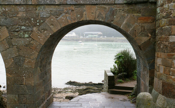 View the bay through stone arch, Dinard, France. 
