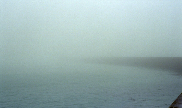 Foggy view of the jetty, Saint Malo, France.