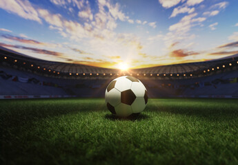 Close up of soccerball in a stadium in the sunset