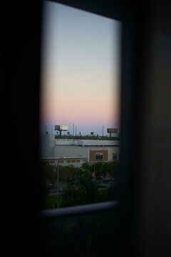 Sunset view through urban window in Miami capturing the essence