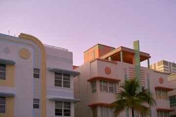 Colorful art deco architecture reflects sunset hues