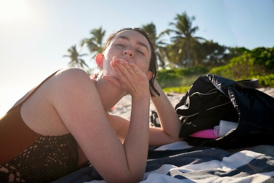 Relaxing moments on a sunny Florida beach surrounded by palm trees 