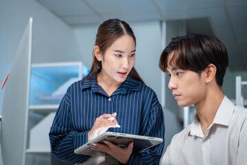 software developer talk strategy plan to executive write prompt AI bot IT app program data analytics in tech startup office.Projected visuals and glowing code on screen.AI chatbot technology concept